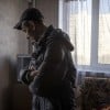 A man looks at the damage in his flat in north eastern Kharkiv due to conflict in the region. (Photo: Ed Ram/Concern Worldwide)