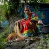 Shochi Ray sorts fish from her today’s catch, releasing the tiny ones back to the pond in Kalinagar, Kamarkhola. Photo: Mumit M/Concern Worldwide