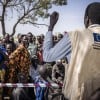 Gatkuoth Matai, Disaster Risk Reduction Officer with Concern South Sudan, speaks to people as they wait for a cash distribution in Chotyiel, Unity State. (Photo: Ed Ram/Concern Worldwide)
