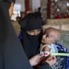 Ismat Ara* (42) visits a Concern nutrition centre with her malnourished child Ashmita* (9 months)