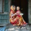 Mitali Mondal is feeding nutritious food to her eighteen months old daughter, Mahi. Every month mothers of the Haldi Bunia community get together once, arrange nutritious meals for their small kids, and feed them together. This session helped mothers to teach each other nutritious meals for their growing children. Several mothers get together and support with the cooking steps. The mother group receives ingredients from the Collective Responsibility, Action, and Accountability for Improved Nutrition (CRAAIN