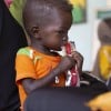 Jamal eats therapeutic food at a nutrition clinic, supported by Concern Worldwide,  in Ardamata, just outside El Geneina, Sudan. Jamal* is severely acutely malnourished.