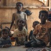 A family in their shelter in one of the displacement camps in Tuban district, where Concern provides health and nutrition services. Photo: Concern Worldwide