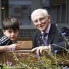 Young boy and Elderly man receive awards for their fundraising efforts