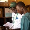 Health and Nutrition Manager Luka Malek Mur and Health Facility Officer checking registers in Northern Bahr al Ghazal, South Sudan. Photo: Hannah Bolder/Concern Worldwide