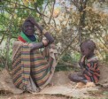 A woman sits with her granddaughter