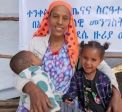 Amint Mohammed Yesuf (26) holding her son Nebil Yimam Kassau (18 months) and her daughter Mieraj Yimam (3) in Abasokotu mobile health clinic