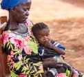 Dominique* holds her orphaned grandchild Sylvie*