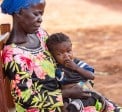 Dominique* holds her orphaned grandchild Sylvie*