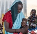 Khadidja* attends the health and nutrition centre with her baby daughter Yassira*