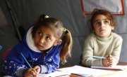 Farah* and Nadia* attends a non-formal education programme in an informal settlement that focuses on early childhood education in Akkar, north Lebanon. Photo: Chantale Fahmi/Concern Worldwide.