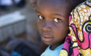 Mujinda Joseph (5) and the foot of his father Yumba Kalofando Banjamin in Tanganyika, DRC. Photo: Concern Worldwide.