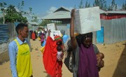 Beneficiaries carrying Kitchen Set donated by Irish Aid to Somalis affected by drought and displacement. Photo: Mohamed Abdiwahab/ Concern Worldwide.