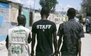 Pascal Louissant, Concern Haiti, walks through Cité Soleil with members of a local "Foundation". Photo: Concern Worldwide.