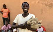 Mika Abdu proudly displays some of his short-season millet crop, grown from seeds supplied by Concern in Niger. Photographer: Darren Vaughan/ Concern Worldwide.
