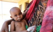 Halimo Hassan (1 year and 2 months) and mother Khayro Ali Hassan (30) in a remote health centre in Filtu, Somali Region. Halimo is being treated for severe acute malnutrition with the support of International NGO Concern Worldwide. Photo: Jennifer Nolan / Concern Worldwide.