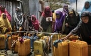 Women gather around water distribution taps in Refugee Camp located in the Afgoye corridor. Photo: Marco Gualazzini / Concern Worldwide.