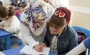 Hadice works with Rania, 10, to strengthen her Turkish skills in an Education Support Centre run by Concern’s local partner in Malatya Province. Photo: Concern Worldwide. 