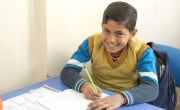 Osama, 12, strengthens his Turkish language skills at a Concern Education Support Centre in Sanliurfa Province, Turkey. Photo: Concern Worldwide.