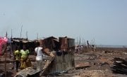 Residents rebuild their homes at the Kroo Bay slum.