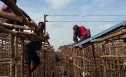 Residents rebuild their homes at the Kroo Bay slum.