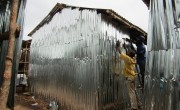 Residents rebuild their homes at the Kroo Bay slum.