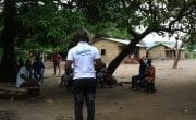 Concern Worldwide Sierra Leone Learning Coach Mohamed Gobril Sesay raising awareness on COVID-19 Bassaia Village Tonkolili District Northern Sierra Leone Photo: Mohamed Saidu Bah / Concern Worldwide