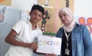 Samer* (14) with a Concern PSS facilitator at the Concern Protection Hub. Photo: Concern Worldwide. 