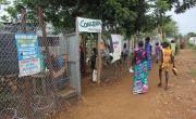 People queue outside the entrance to the Concern Nutrition Facility in Juba