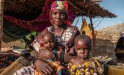 Puebla* with her two children at an unofficial IDP site in Burkina Faso where community leaders say food shortages are a constant worry. Photo: Henry Wilkins / Concern Worldwide