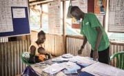 Nyahok Diew waits to be seen at the health care clinic with her 10-month-old daughter, Nyariek. Photo: Ed Ram/Concern Worldwide