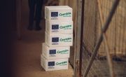 Five Concern-branded hygiene kits stacked on top of each other at IDP camp in Iraq