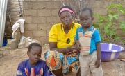 Sylvie Adama Oubda, an internally displaced person, with two of her children,