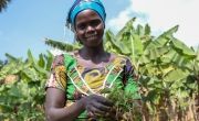 Beatha Uwitonze standing in her farm in Rwanda