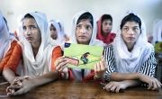 Three girls in classroom learning about hygiene