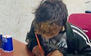 Syrian child drawing in class