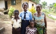 Favor B Tarr, with three of her children, Shem, Princess, and Jessica, at their home in Kaytor Town, Grand Bassa, Liberia. Favor has been receiving training and support from Concern in an integrated programme for food security, agriculture, and livelihoods. (Photo: Kieran McConville/Concern Worldwide)