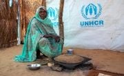 Fatima* preparing kisra bread, which her children sell at the camp for income. (Photo: Eugene Ikua/Concern Worldwide)