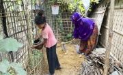 Kulsum* with her daughter in their home garden at Camp 13. (Photo: Saikat Mojumder/Concern Worldwide)