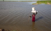 Nyakeok Top Leny (56) returns from harvesting water lilies in the flooded waters of Bentiu, South Sudan. (Photo: Eugene Ikua/Concern Worldwide)
