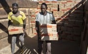 Workers in Chad load a consignment of 45 tonnes of Plumpy'Nut destined for Sudan. (Photo: Kieran McConville/Concern Worldwide)