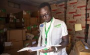 Omran Elimin Dood Mohamed of the Concern nutrition team in West Darfur, checks supplies at the Concern warehouse in El Geneina. Photo: Kieran McConville/Concern Worldwide