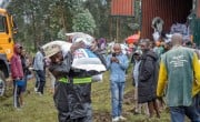 Hercules Samuel, Emergency Response Programme Manager, carries and distributes food in Kibumba