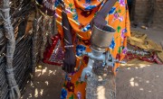 Mahadia Gamar demonstrates the peanut grinder she bought with Concern's support. She earns extra income grinding nuts for other women in her community. Photos: Eugene Ikua/Concern Worldwide