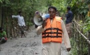 In Nobabganj, Sundarganj, the Union Parishad has issued a forecast regarding the rising water levels in the Teesta River, following several days of heavy rainfall. Mohammad Dukhu Mia (38) was the first to take action, spreading the news throughout the community and raising awareness among residents and to prepare to face the possible disaster. Photo: Saikat Mojumder/Concern Worldwide