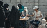 The Concern Yemen team distribute shelter materials to people affected by the sandstorm that struck Al Anad IDP Camp, Tuban District. Photo: Ammar Khalaf/Concern Worldwide