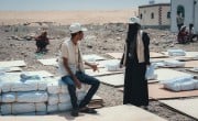 The Concern Yemen team distribute shelter materials to people affected by the sandstorm that struck Al Anad IDP Camp, Tuban District. Photo: Ammar Khalaf/Concern Worldwide