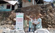 Dry food ration items are distributed to flood affected community members in Pakistan