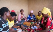 Bernadette Katungu Kamatogha (center right, in pink head scarf) with her local VSLA. Photo: Eugene Ikua / Concern Worldwide
