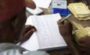 Scenes from a VSLA meeting in Sierra Leone. Photos: Kieran McConville / Concern Worldwide